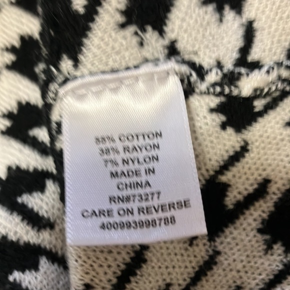 Adorable peplum top, classic black and white. Great for spring! - Picture 4 of 5